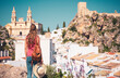 Woman tourist enjoying view of Olvera- Famous white village in Spain