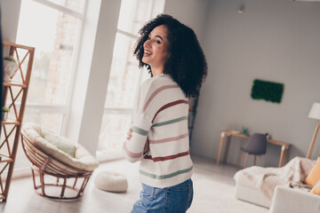 Sticker - Photo of cheerful positive lady dressed striped pullover laughing arms crossed indoors apartment room