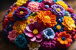 Colorful knitted dahlias flowers made yarn on wooden desk. Wool floral decoration.