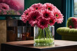 Fresh pink gerberas flowers in a glass pot on wooden table in home room