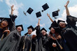 © dtatiana - Group of graduates tossing their caps in the air against a backdrop of blue sky, education, graduation concept