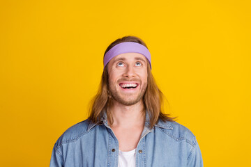 Sticker - Photo portrait of attractive young hippie man look up excited empty space wear trendy denim outfit isolated on yellow color background