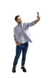 © Who is Danny - A man taking a selfie with a smartphone isolated on a white background, wearing casual clothing, in a natural pose