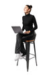 © Who is Danny - A woman smiling and sitting on a stool with a laptop, dressed in black attire, isolated on a white background, showing a concept of casual remote work