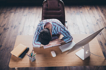 Wall Mural - High angle view photo of young corporate man sleep desktop wear striped shirt modern office home indoors