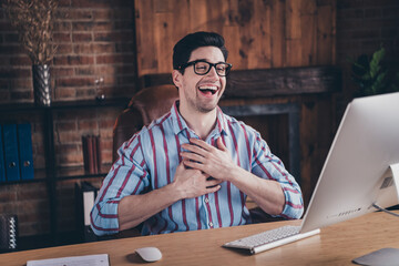 Sticker - Portrait of nice young man laugh video call wear striped shirt loft interior business center indoors