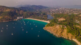 Fototapeta Na sufit - Beautiful beach with colorful water. Top view of the beautiful coastline. Sunny summer day. Colorful water. Sandy beach.	