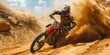 Extreme motocross in the desert. The racer rides along a sandy track
