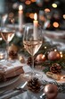 © Natalia - Sophisticated Christmas table setting featuring champagne glasses, candlelight, and festive pine decorations