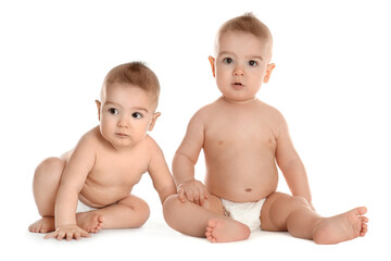 Poster - Portrait of cute twin babies on white background