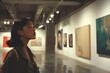 © Dm - Asian girl wearing looking artworks on the wall in art gallery. woman studying art paintings in a museum