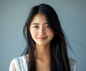 Wall Mural - Young Japanese Woman With Long Black Hair and White Shirt