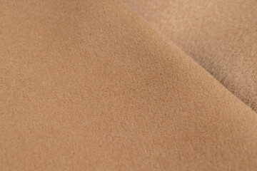 orange fleecy fabric is part of a garment, part