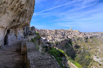 Wall Mural - Skyline of the Sassi of Matera: view of the historic center and the ravine of Murgia Materana from an alley dug into the limestone.