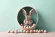 Easter Bunny peeking out of a hole with chocolate easter eggs on pastel wall banner with copy space