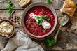 Bowl of beet root soup borsch on wooden table