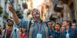 © MNStudio - Tour guide leading a group of visitors to tourist attractions, giving them information and insights, pointing at local architecture.