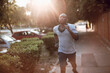 © Geber86 - Active young black man jogging on the street