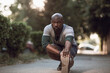 © Geber86 - Active young black man stretching on the street