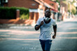 © Geber86 - Active young black man jogging on the street