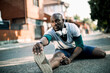 © Geber86 - Active young black man stretching on the street