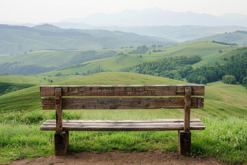 Wall Mural - A rustic wooden bench overlooking a peaceful countryside vista with rolling hills, isolated on solid white background.