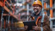 ©  Green Creator - Happy businessman with hardhat standing with tablet pc at construction site