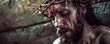 Detailed image of a man wearing a crown of thorns, with blood on his face and beard. Jesus Christ with Crown of Thorn, banner