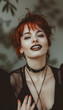 Portrait of a redhead woman in fashionable clothing. Fashion beauty style shoot. Red lipstick and punky, goth style.