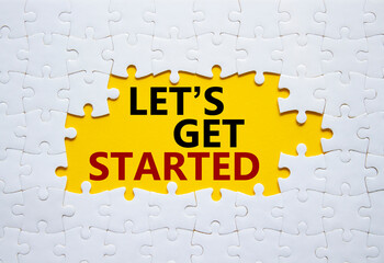 lets get started symbol. concept words lets get started on white puzzle. beautiful yellow background
