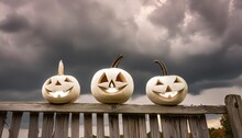 Three Pumpkins On A Wooden Fence In Front Of A Dark Cloudy Sky Pumpkins Are Carved With Faces And Have Glowing Eyes The Picture Is Scary And Mysterious With A Dark Gloomy Atmosphere Generative Ai