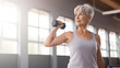 © photo for everything - elderly woman exercising with a dumbbell