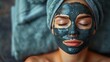Facial mask with charcoal for a woman who is relaxing