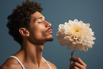 Wall Mural - Man and a white flower, summer minimal concept, blue background