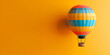 © alphazero - Brightly Colored Hot Air Balloon on Yellow