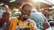 © Ольга Листратова - happy young man, car wash worker, shows class, thumbs up and looks at camera; car wash on a blurred background, space for text; banner, Sunny day.