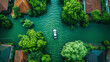 The aerial view of a flooded residential area with a car trying to pass the rising water on the intersection of the road