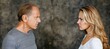 © Ilja - Intense confrontation  a furious man and woman engaged in a heated stare off conflict