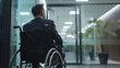 © EmmaStock - A businessman in a wheelchair is meeting with the team in the office