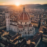 Aerial view of the breathtaking sunset over florence cathedral, a historical landmark in italy with its iconic dome, showcasing the city's stunning architecture and rich cultural heritage
