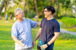 © CandyRetriever  - Happy Asian adult son and elderly father jogging exercise together at park. Retired man with outdoor lifestyle sport workout in the city. Family relationship and senior people health care concept.