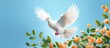 white dove flying against the background of flowers and blue sky