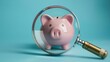 Piggy bank and magnifying glass on blue background, savings and economy concept