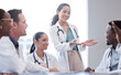 © peopleimages.com - Promotion, healthcare and doctors in meeting, new employee and planning with schedule in hospital. Staff, happy group or surgeon with approval for research, medical and professional with conversation