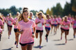 © Favio - portrait of a cute girl running in a marathon, smiling and  wearing a pink t-shirt. Concept o charity race
