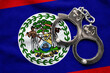 Flag of Belize and police handcuffs. Crime and offenses in country Concept
