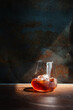 a glass of homemade cold cold brew coffee with ice on rustic table background.