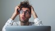 © Naknakhone - Portrait of confused man looking at computer screen. Puzzled employee, office worker, student or hipster feeling dumb and stupid trying to understand hard complicated stuff. copy space.