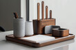 A set of contemporary desk accessories, such as a pen holder, memo pad holder, and business card holder, arranged in a row on a minimalist desk, keeping essentials organized in style.