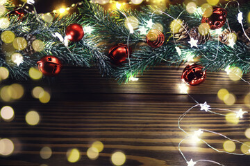 Wall Mural - Christmas and New Year wooden background with light. Border art design with Christmas tree